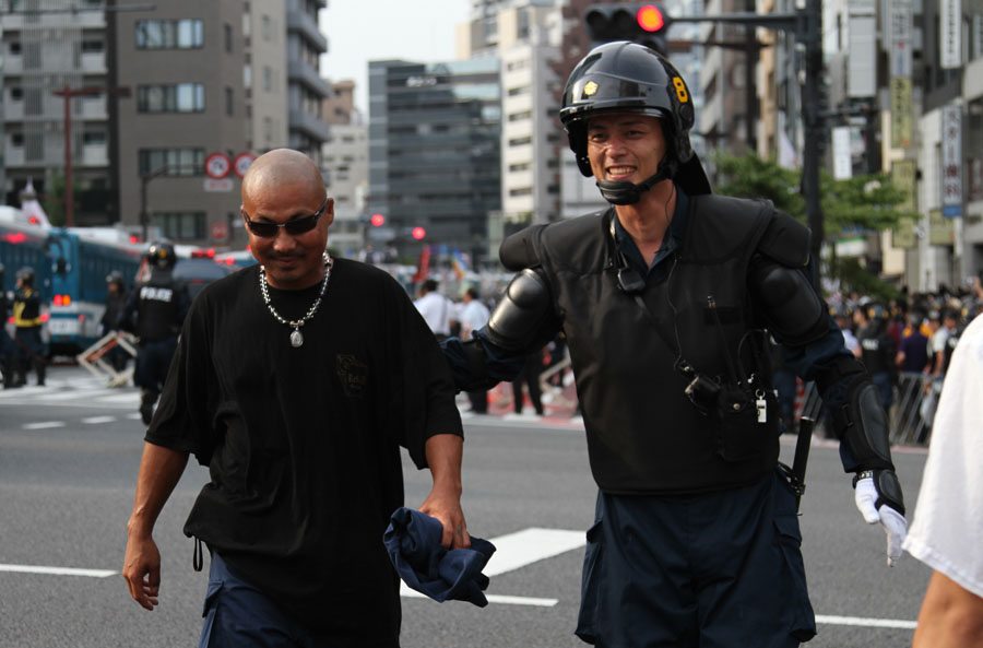 Right-wing groups protest anti-Yasukuni Shrine march in Tokyo Right-wing groups protest anti-Yasukuni Shrine march in Tokyo