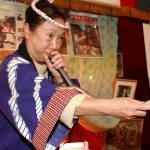 Carnival 'snake lady' at Hanazono Shrine in Shinjuku