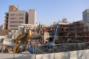 View of TSK.CCC building during demolition in 2008 with Roppongi Hills at right