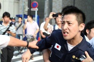 Right-wing group Gishin Gokoku-kai at a left-wing protest near Yasukuni Shrine in Tokyo's Chiyoda Ward
