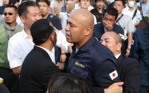 Shinichi Kamijo of right-wing group Gishin Gokoku-kai at a left-wing protest near Yasukuni Shrine in Tokyo's Chiyoda Ward