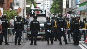 Right-wing groups opposed by police outside Yasukuni Shrine on August 15