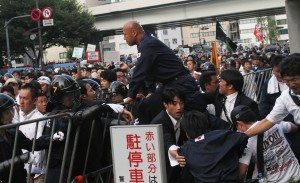Right-wing groups clash with police during a rally opposing Yasukuni Shrine
