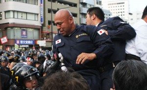 Right-wing groups clash with police during a rally opposing Yasukuni Shrine