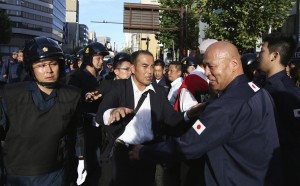 Shinichi Kamijo (right) of the Gishin Gokoku-kai protests in Jimbocho