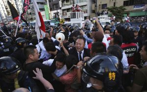 Right-wing protestors with police in Jimbocho