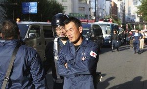 A right-wing member gets ready for the protest in Jimbocho
