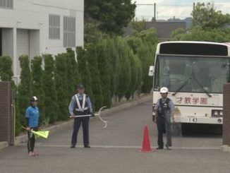 A man is at large after slashing a woman with a knife at a school in Matsumoto City on Monday