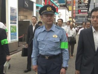 Tokyo police and government officials