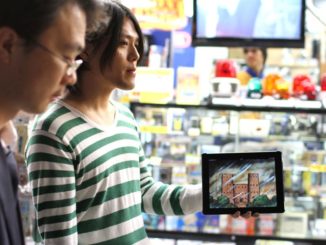 Yuta Sasaki with his iPad in Akihabara