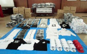 Police seized more than 1,000 fake items from a shop run by the suspects