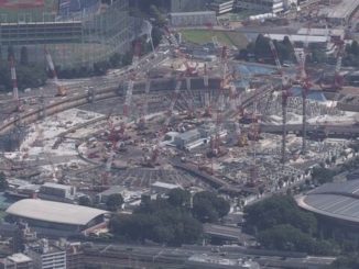 A worker at the site of the National Stadium committed suicide in March after working excessive overtime