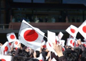 Waving flags greeting the Emperor upon his emergence on the perch