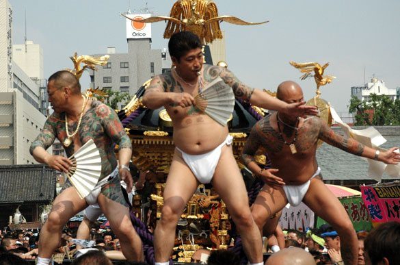 Members of the Asakusa Takahashi-gumi atop a mikoshi at the Sanja Matsuri
