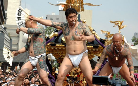 Members of the Asakusa Takahashi-gumi atop a mikoshi at the Sanja Matsuri