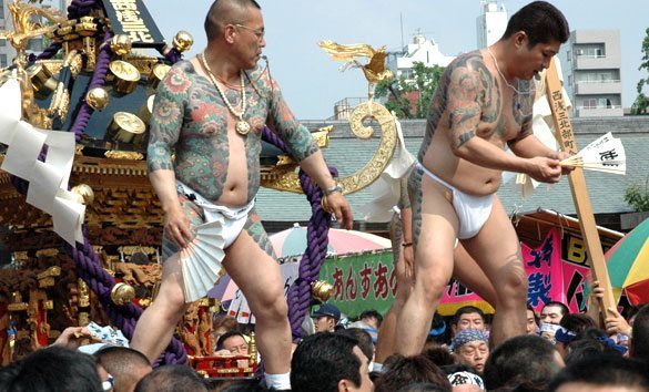 Members of the Asakusa Takahashi-gumi atop a mikoshi at the Sanja Matsuri