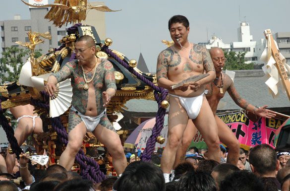 Members of the Asakusa Takahashi-gumi atop a mikoshi at the Sanja Matsuri