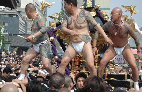 Members of the Asakusa Takahashi-gumi atop a mikoshi at the Sanja Matsuri