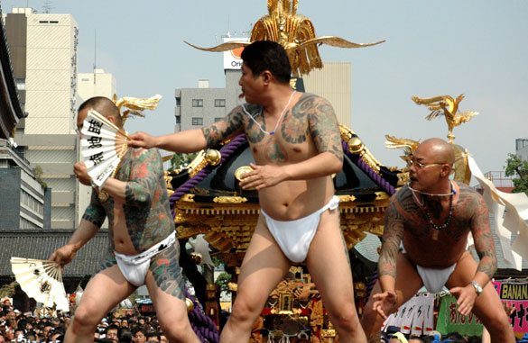 Members of the Asakusa Takahashi-gumi atop a mikoshi at the Sanja Matsuri