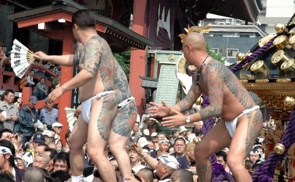 Members of the Asakusa Takahashi-gumi atop a mikoshi at the Sanja Matsuri
