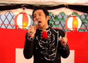Yusuke Hama performs during a festival at the entrance to the Golden Gai entertainment area of Shinjuku