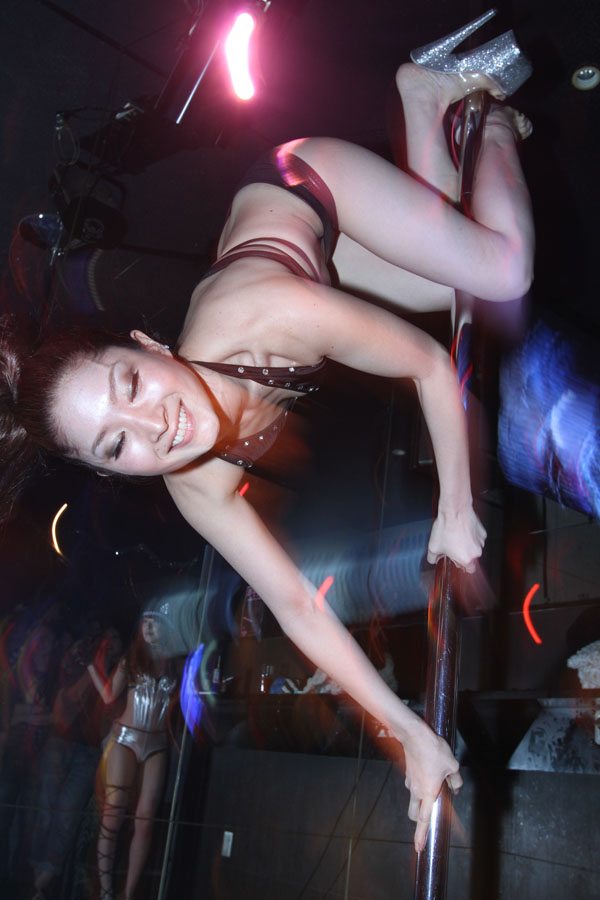 Pole dancers perform at club IBEX in Tokyo's Roppongi district Pole dancers perform at club IBEX in Tokyo's Roppongi district