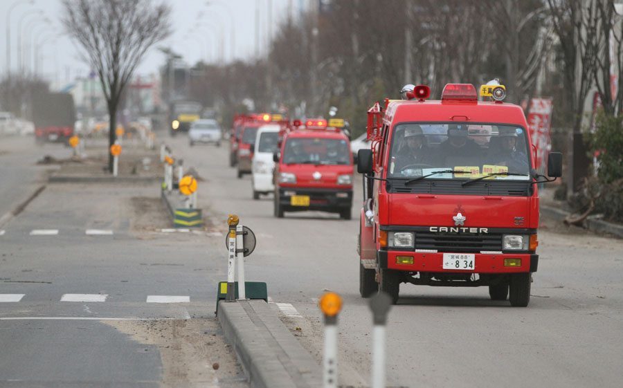 Emergency vehicles on Sendai Airport entrance road