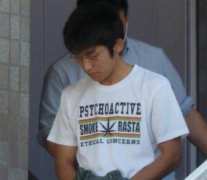 Shinichi Fukuoka being taken into custody