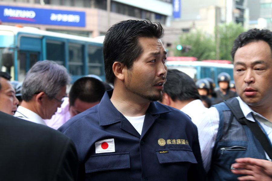 Right-wing group Gishin Gokoku-kai at a left-wing protest near Yasukuni Shrine in Tokyo's Chiyoda Ward