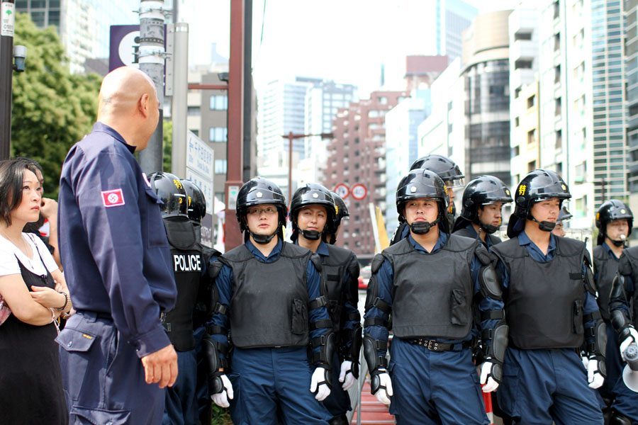 Shinichi Kamijo of right-wing group Gishin Gokoku-kai at a left-wing protest near Yasukuni Shrine in Tokyo's Chiyoda Ward