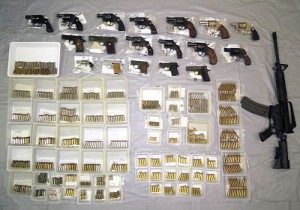 Police seized pistols, a rifle and ammunition