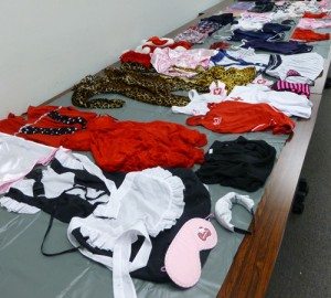 Officers confiscated a number of maid and school-girl uniforms from the suspect's residence
