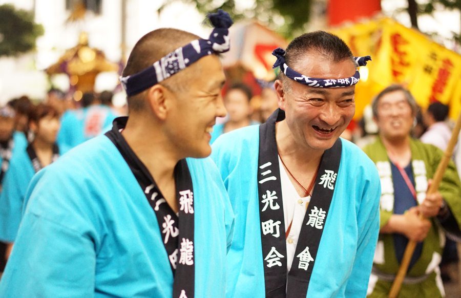 Two revelers in happi coats