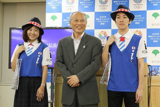 Yoichi Masuzoe gets a preview of the new uniforms for Tokyo guides