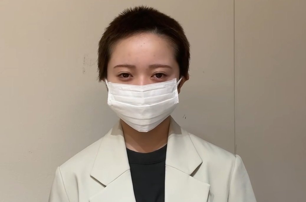 Meik Hanada appearing in the clip with a shaved head