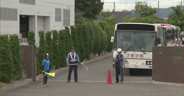 A man is at large after slashing a woman with a knife at a school (NHK)