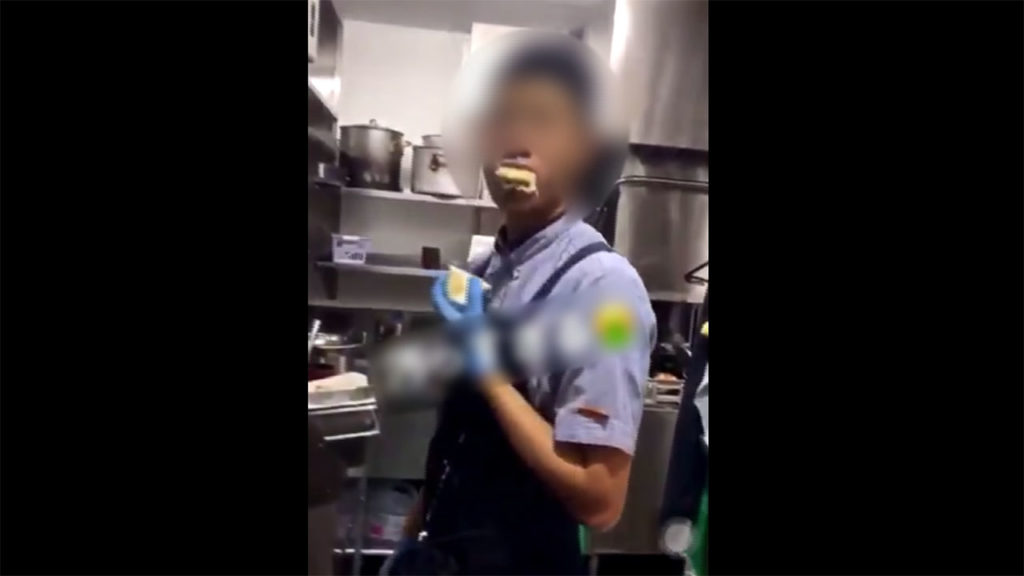 An employee of chain Ootoya eats pudding in the kitchen of an outlet
