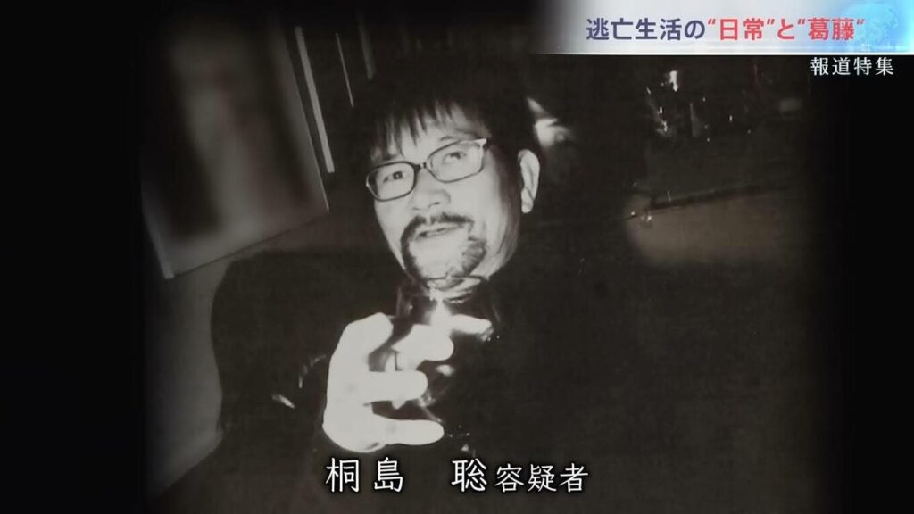 Satoshi Kirishima with a glass of wine