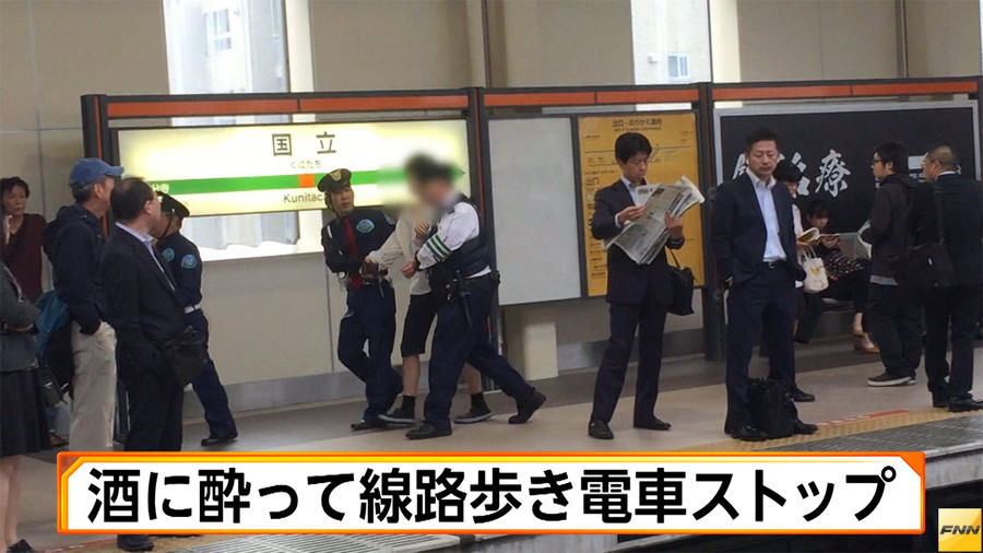 A drunk university student was found walking along railway tracks on Friday morning