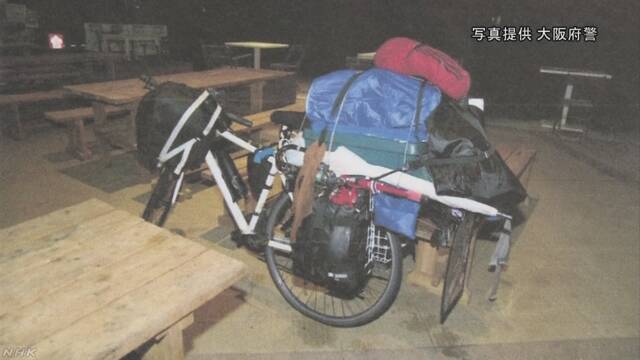 Junya Hida pedaled a bicycle while on the run