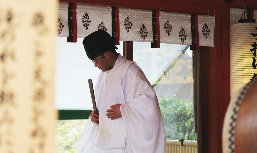 A Shinto priest at work