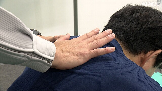 use the heel of your palm to hit the area between their shoulder blades with force