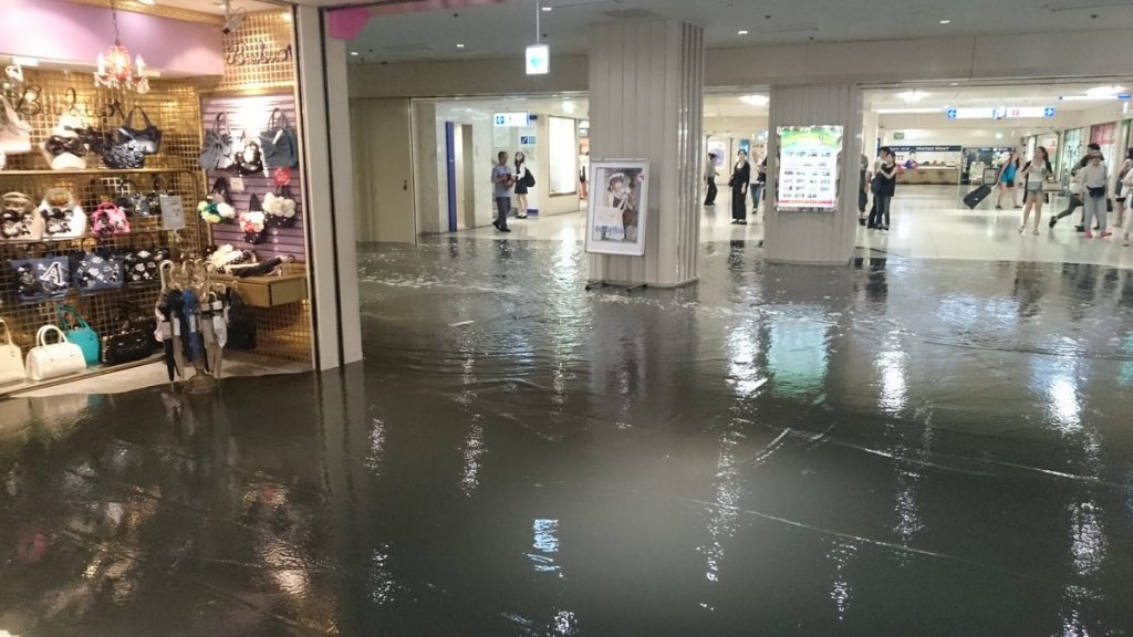 Blackish grey water inundated Shinjuku Subnade at JR Shinjuku Station on Wednesday