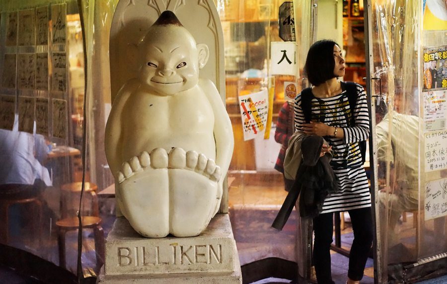 The Billiken charm doll welcomes guests