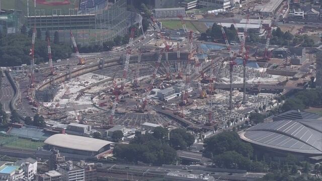 A worker at the site of the National Stadium committed suicide in March after working excessive overtime