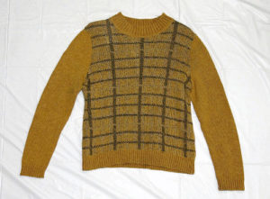 woman wearing a light brown sweater