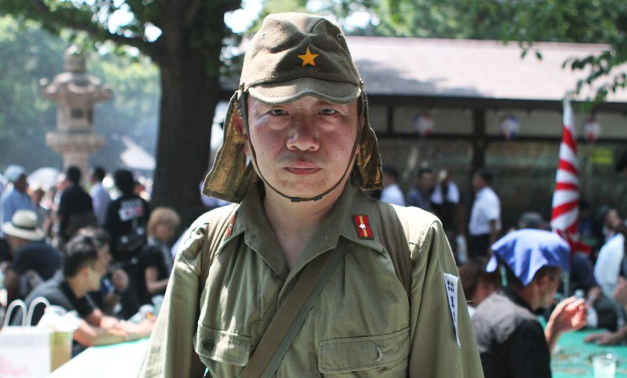 A man dresses as a soldier at Yasukuni Shrine on August 15